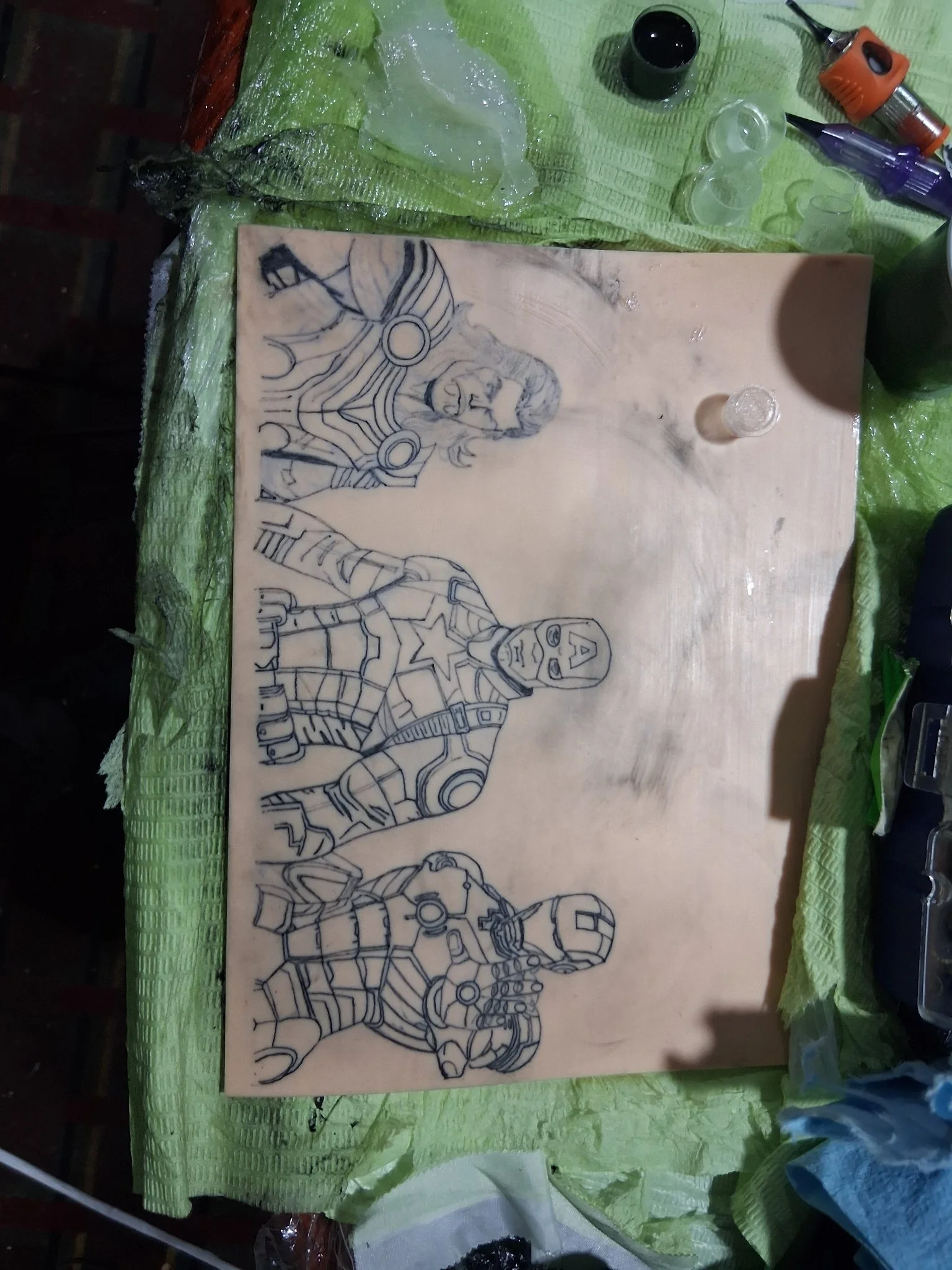 Pencil sketch of Marvel superheroes on wood surface, work in progress