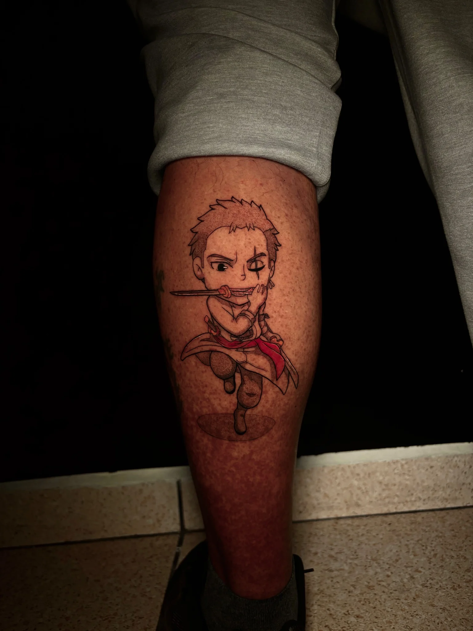 Chibi Roronoa Zoro anime tattoo on calf