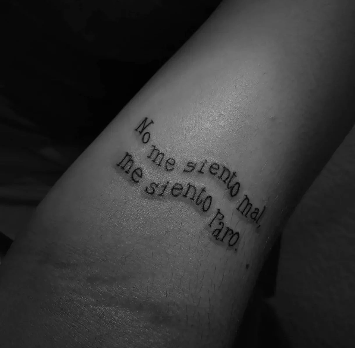 Spanish script quote tattoo in typewriter font on wrist