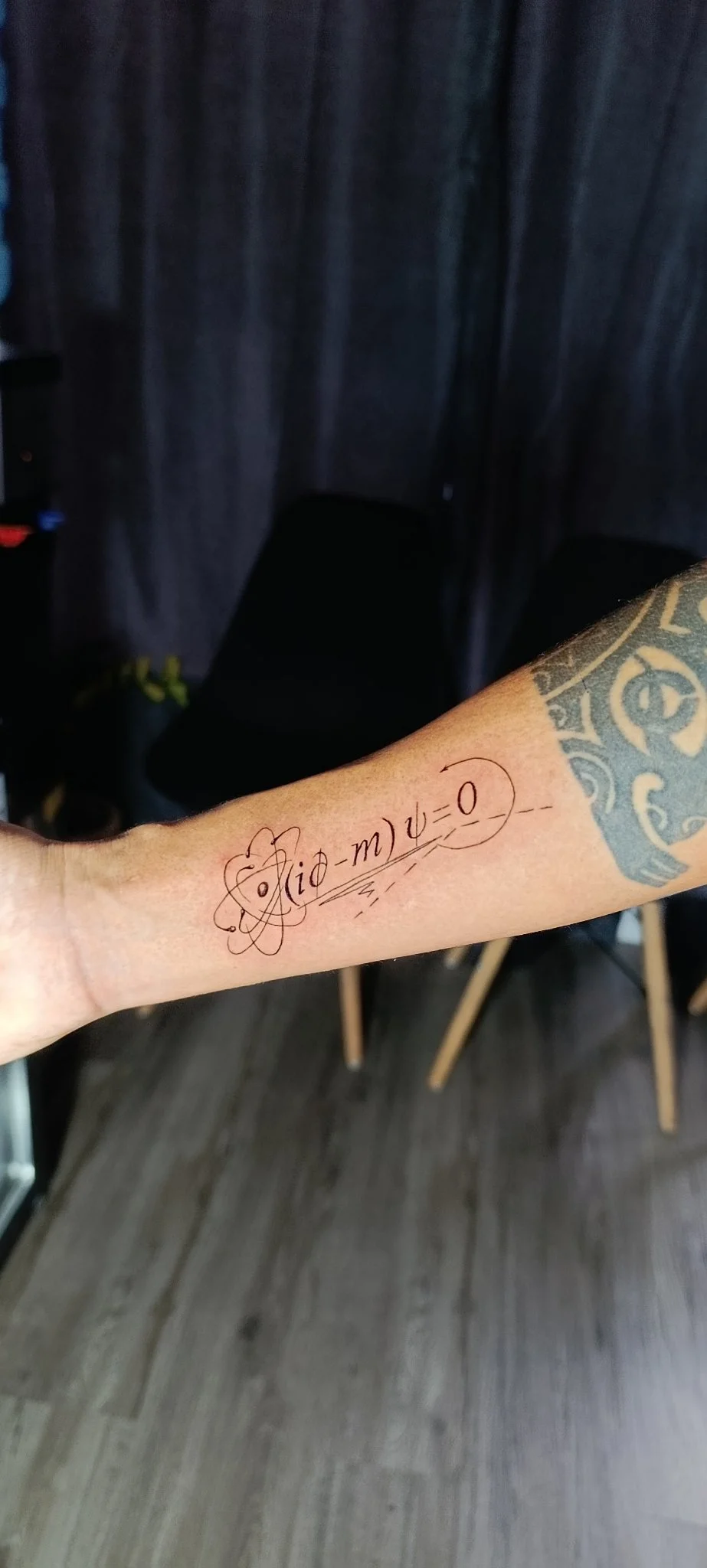 Fine line Dirac equation physics tattoo on forearm