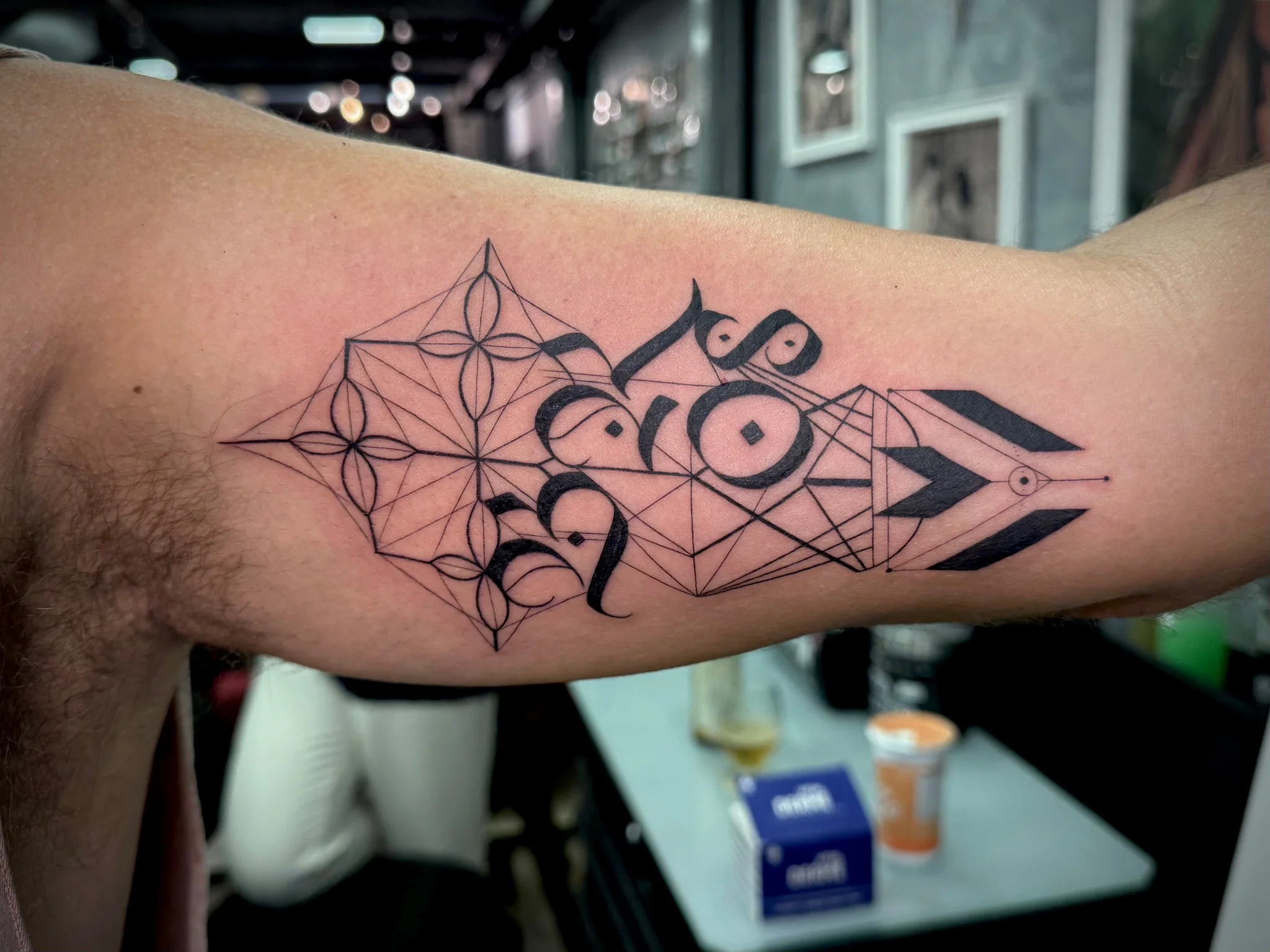Geometric tattoo by Clarice Granado