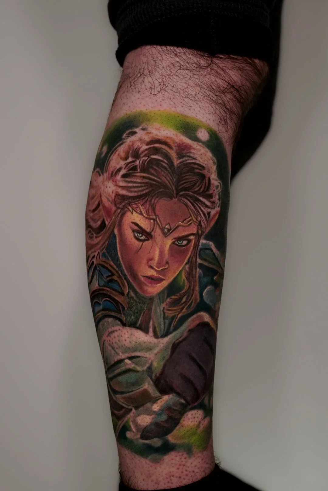 Color realism fantasy elf portrait tattoo on lower leg