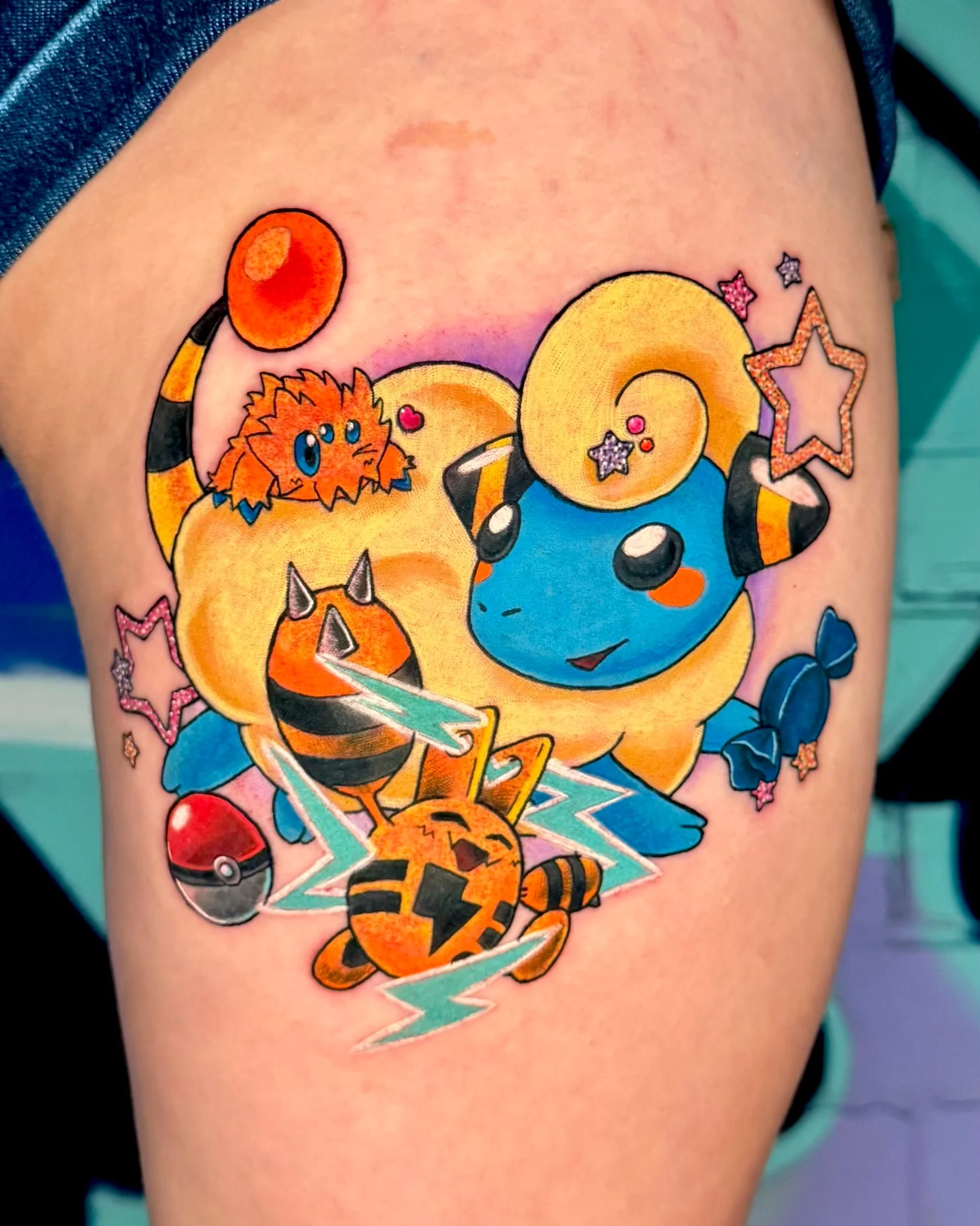 Colorful New School Pokemon tattoo featuring electric-type characters on thigh