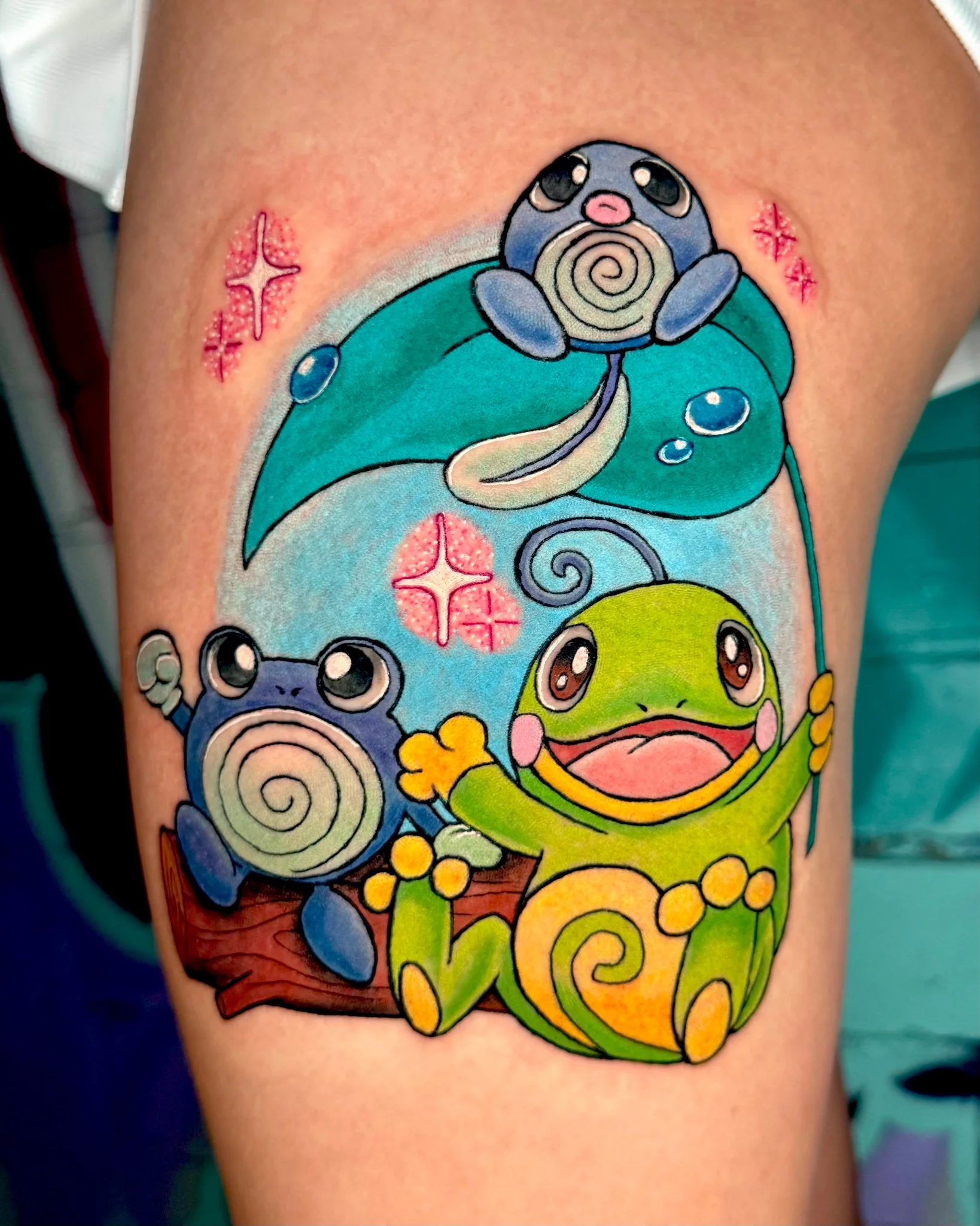 Vibrant New School Pokemon tattoo featuring Poliwag and Treecko on thigh