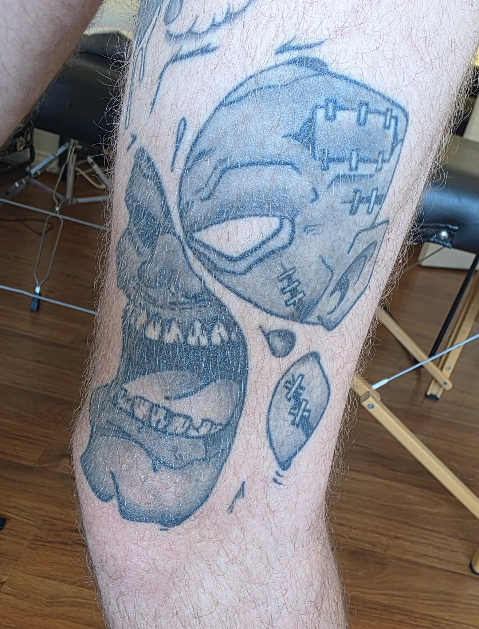 Black and grey horror zombie skull tattoo on lower leg
