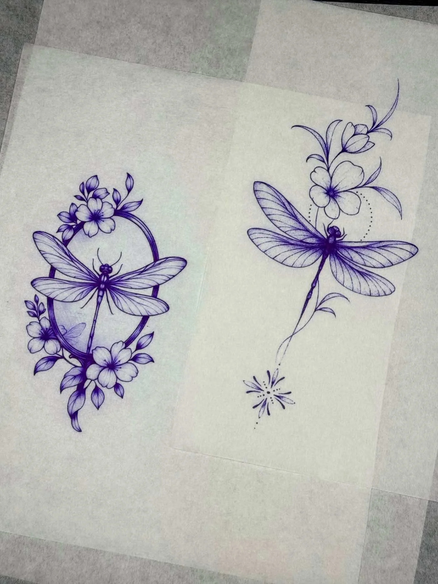 Fine line dragonfly and floral tattoo stencil designs on transfer paper