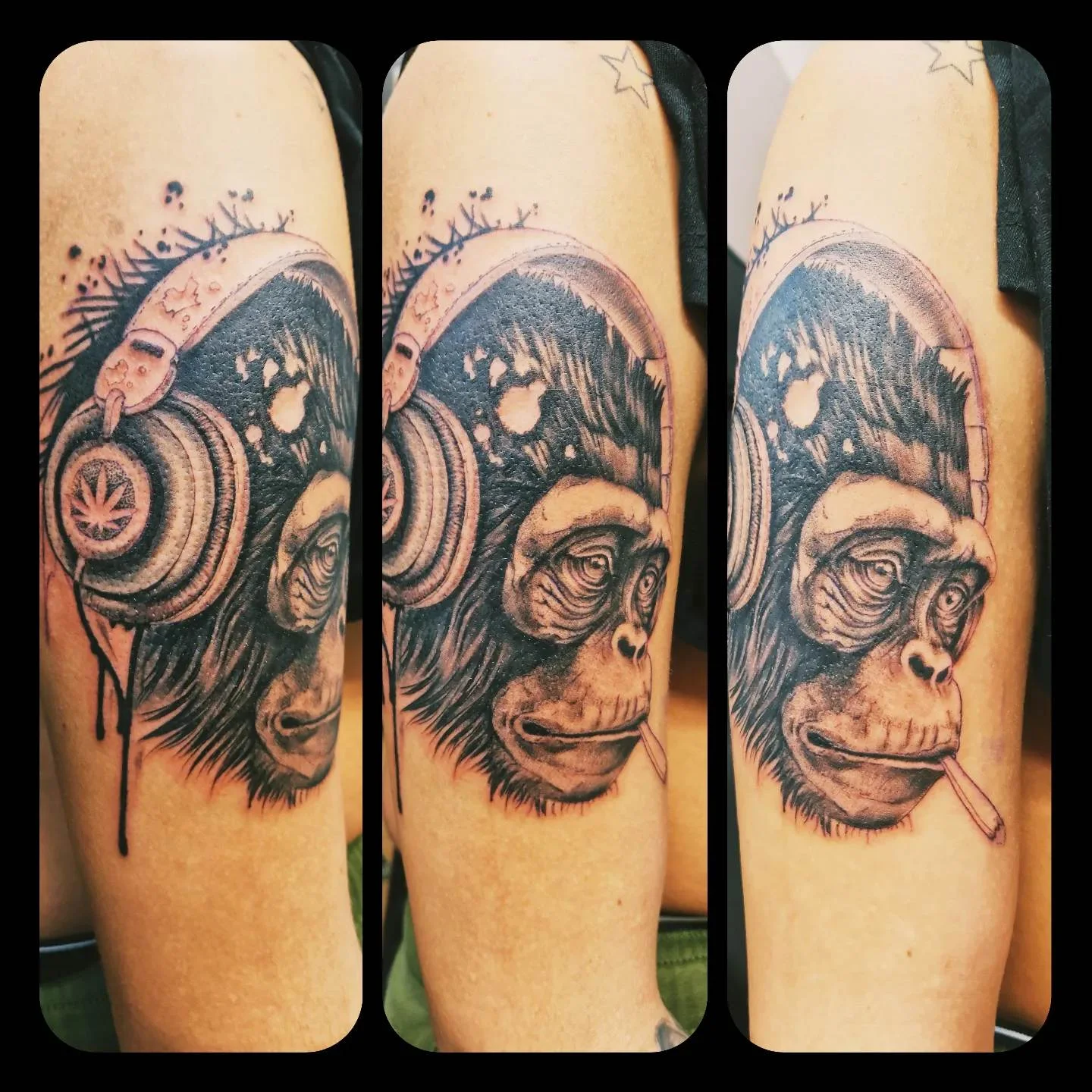 Black and grey chimpanzee with headphones tattoo on upper arm