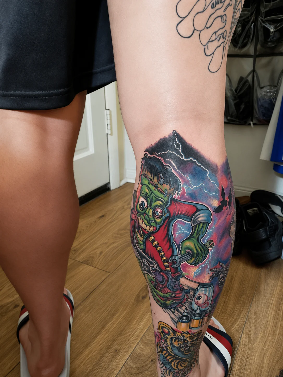 Colorful New School Frankenstein monster tattoo on calf