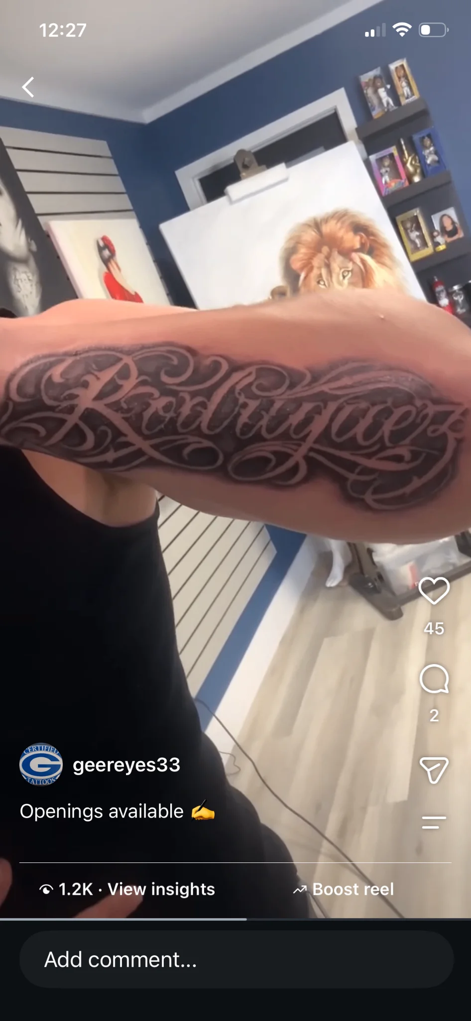 Bold cursive script name tattoo reading Rodriguez on forearm