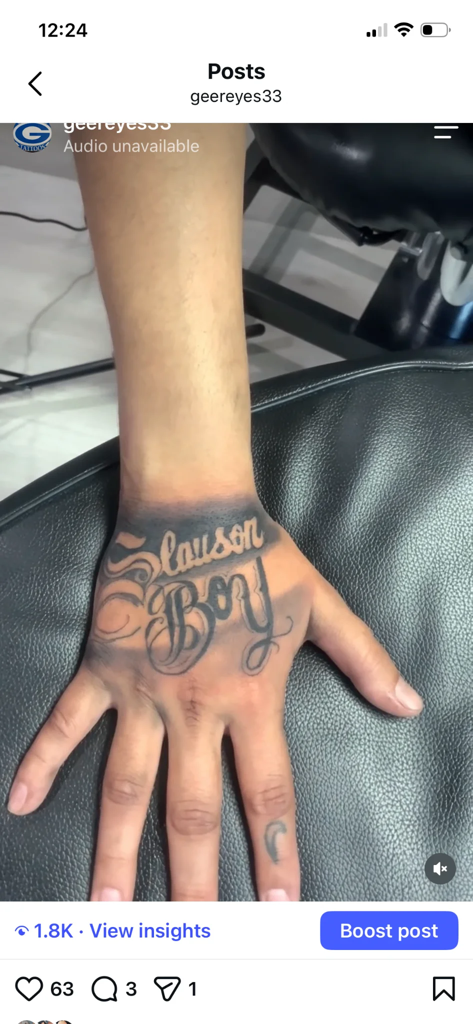 Black and grey Chicano script lettering tattoo on hand