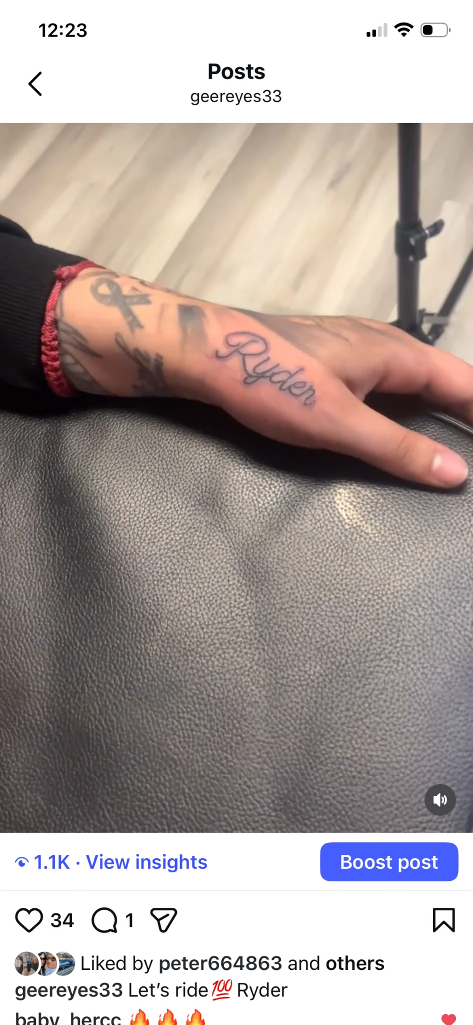 Script name tattoo reading Ryder on the back of the hand