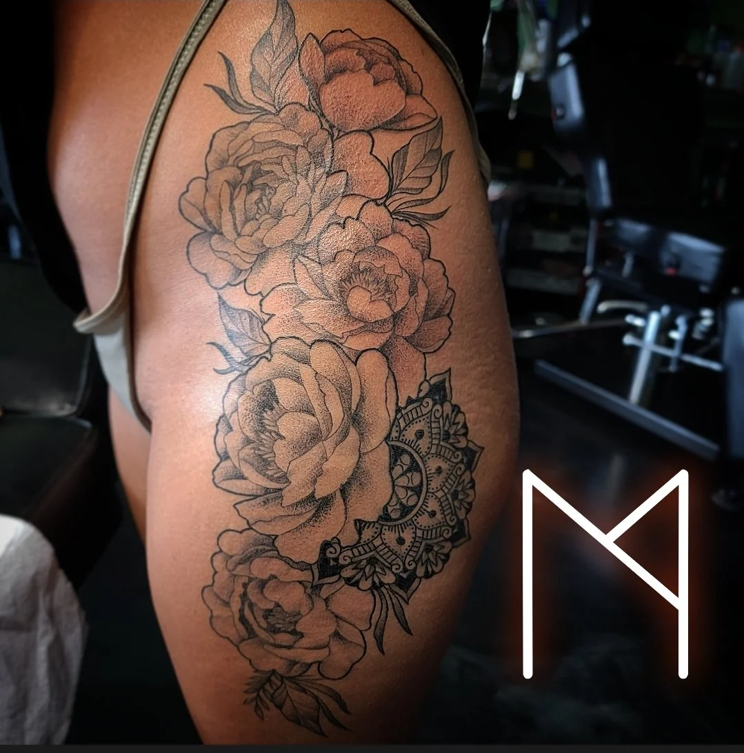 Black and grey peony and mandala floral sleeve on upper arm