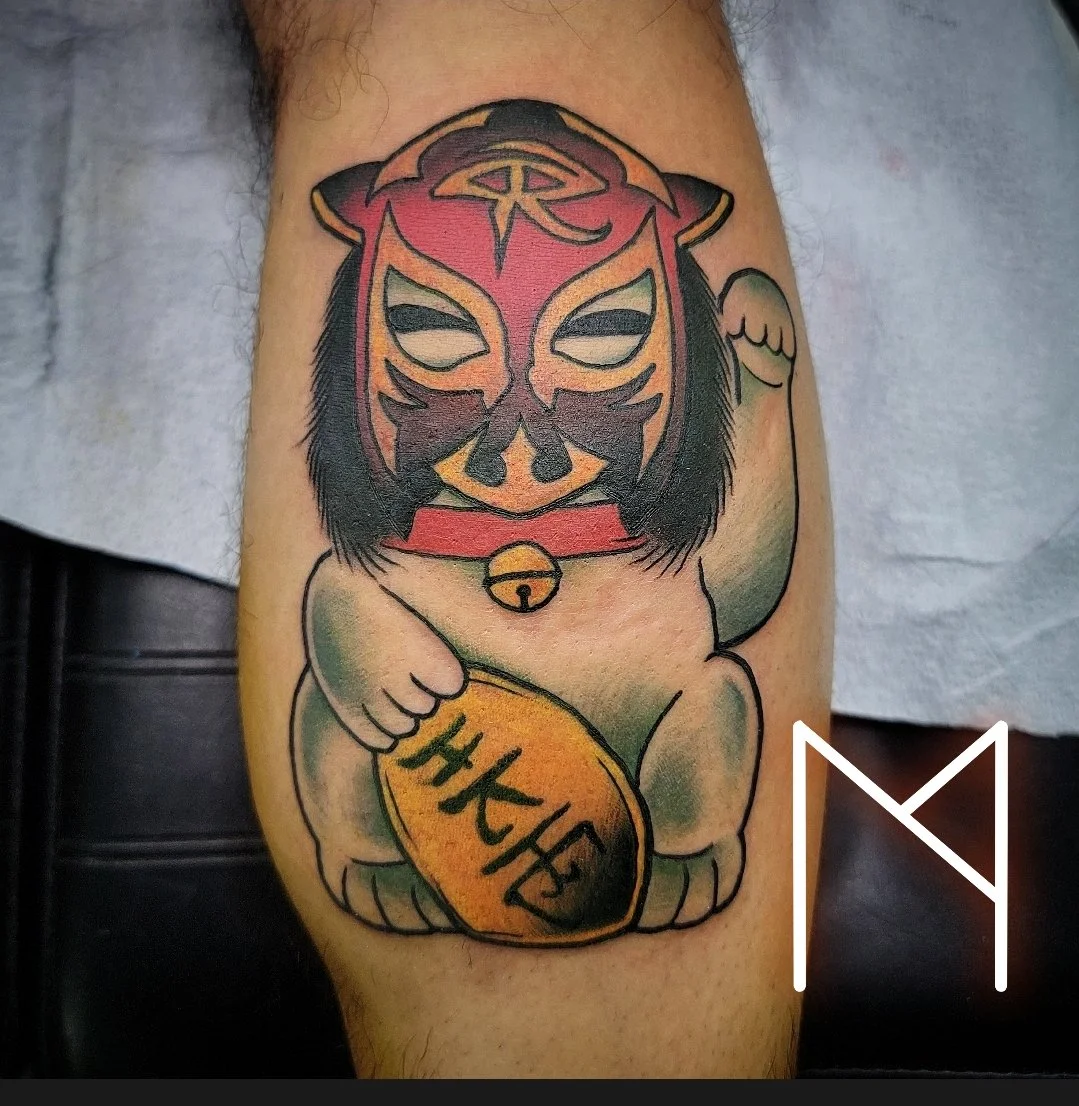 Neo-traditional lucky cat with lucha libre mask tattoo on leg