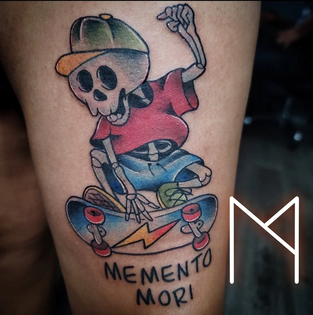 New school skating skeleton tattoo with memento mori lettering on leg