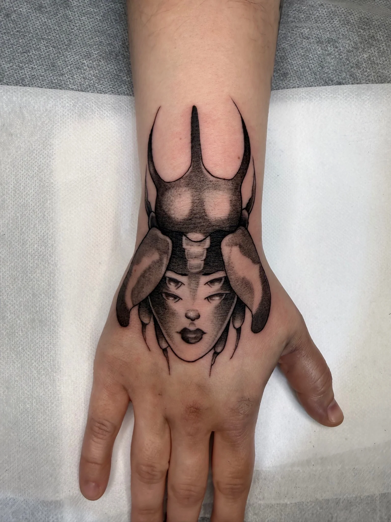 Black and grey anime warrior woman with horned helmet on hand