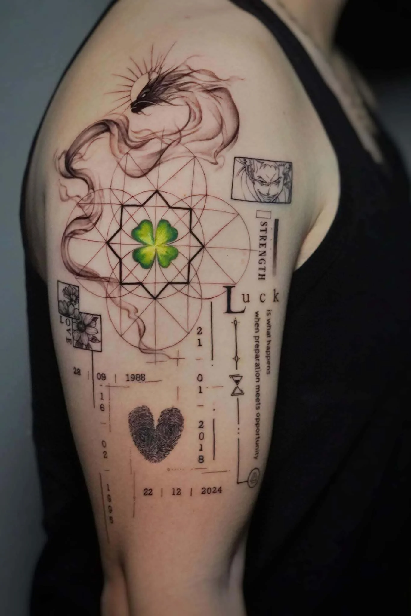 Patchwork upper arm tattoo with dragon, clover, geometric design, and dates