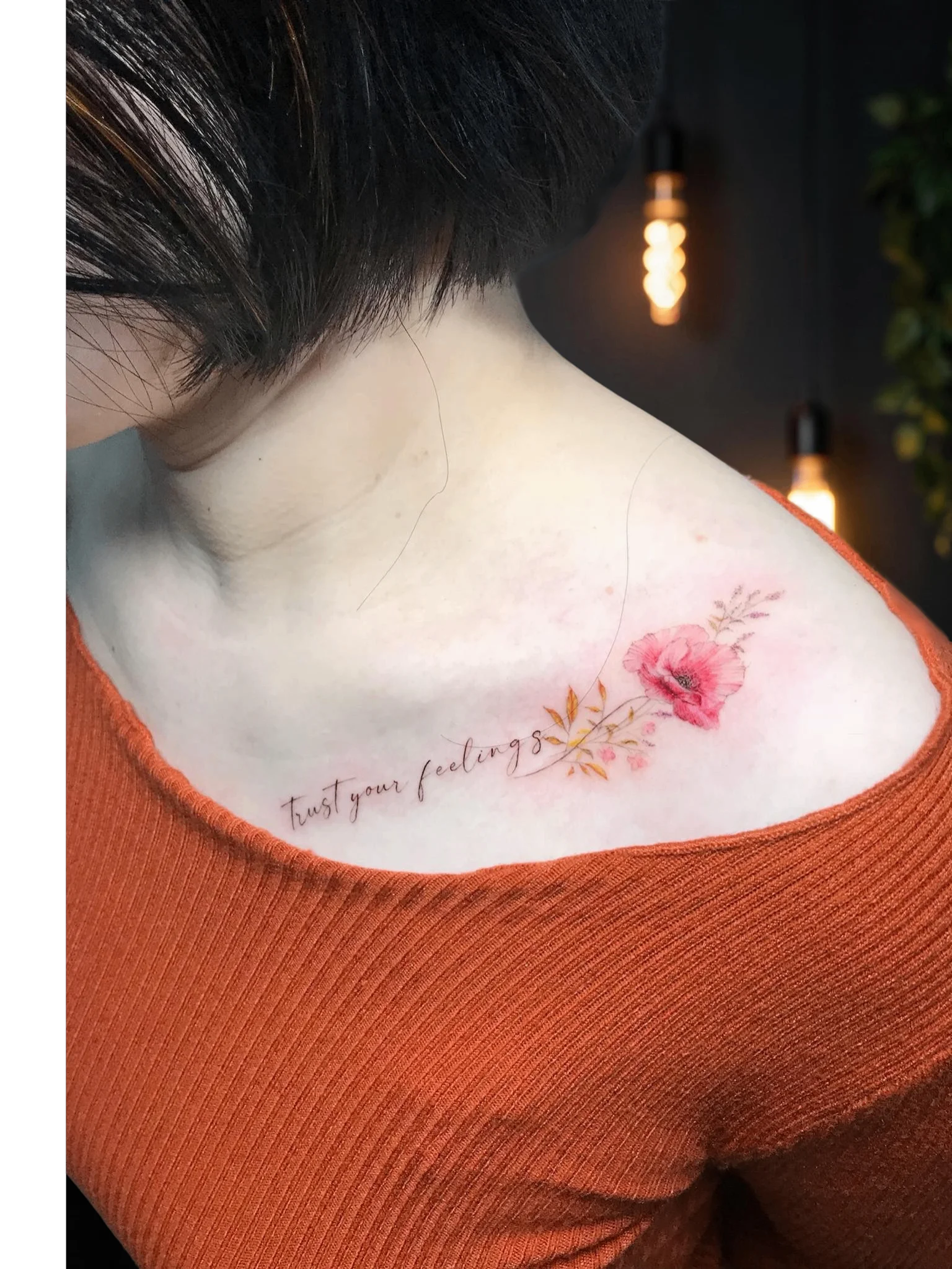 Watercolor poppy with script lettering on upper back collarbone