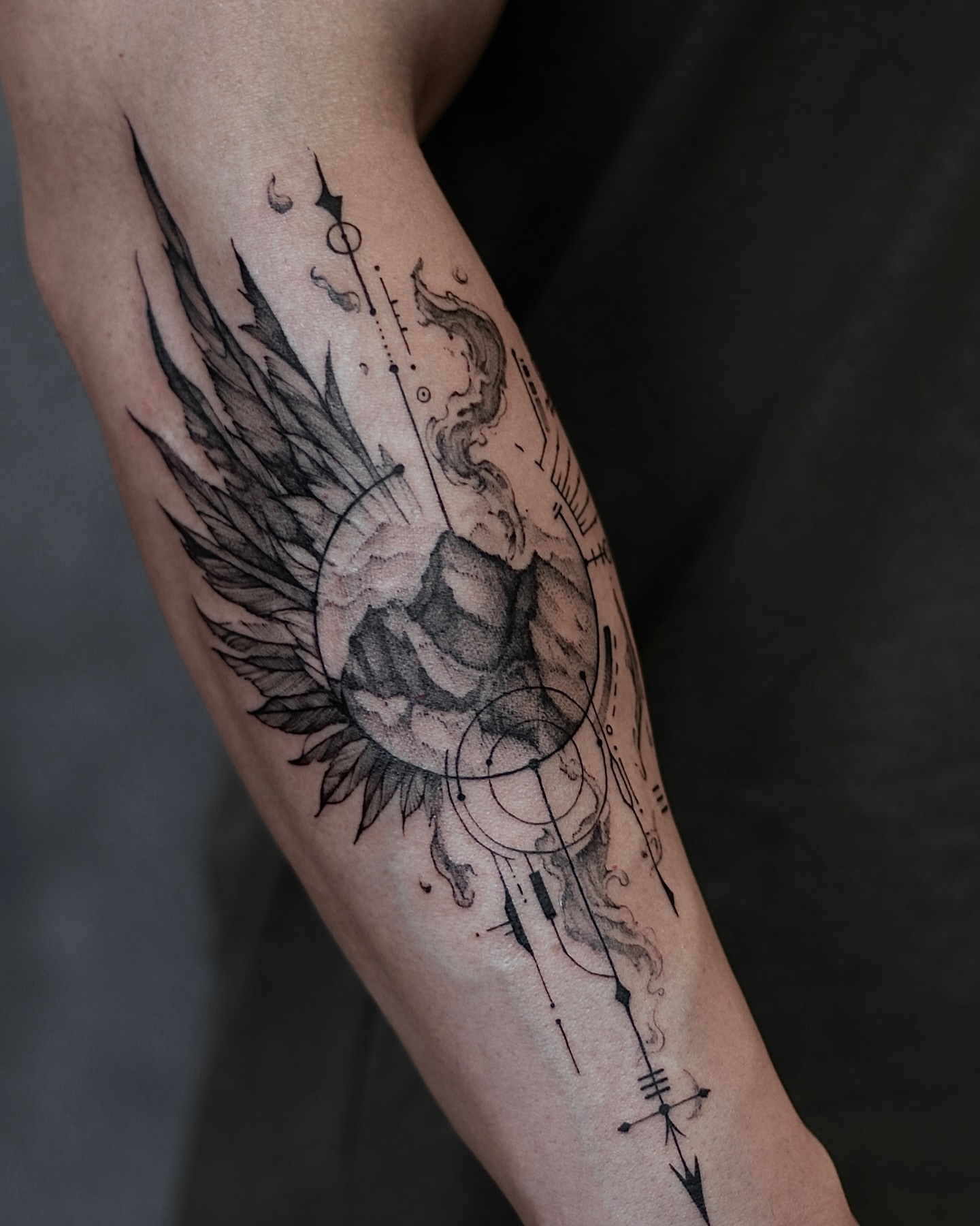 Illustrative angel with wings and musical elements on forearm