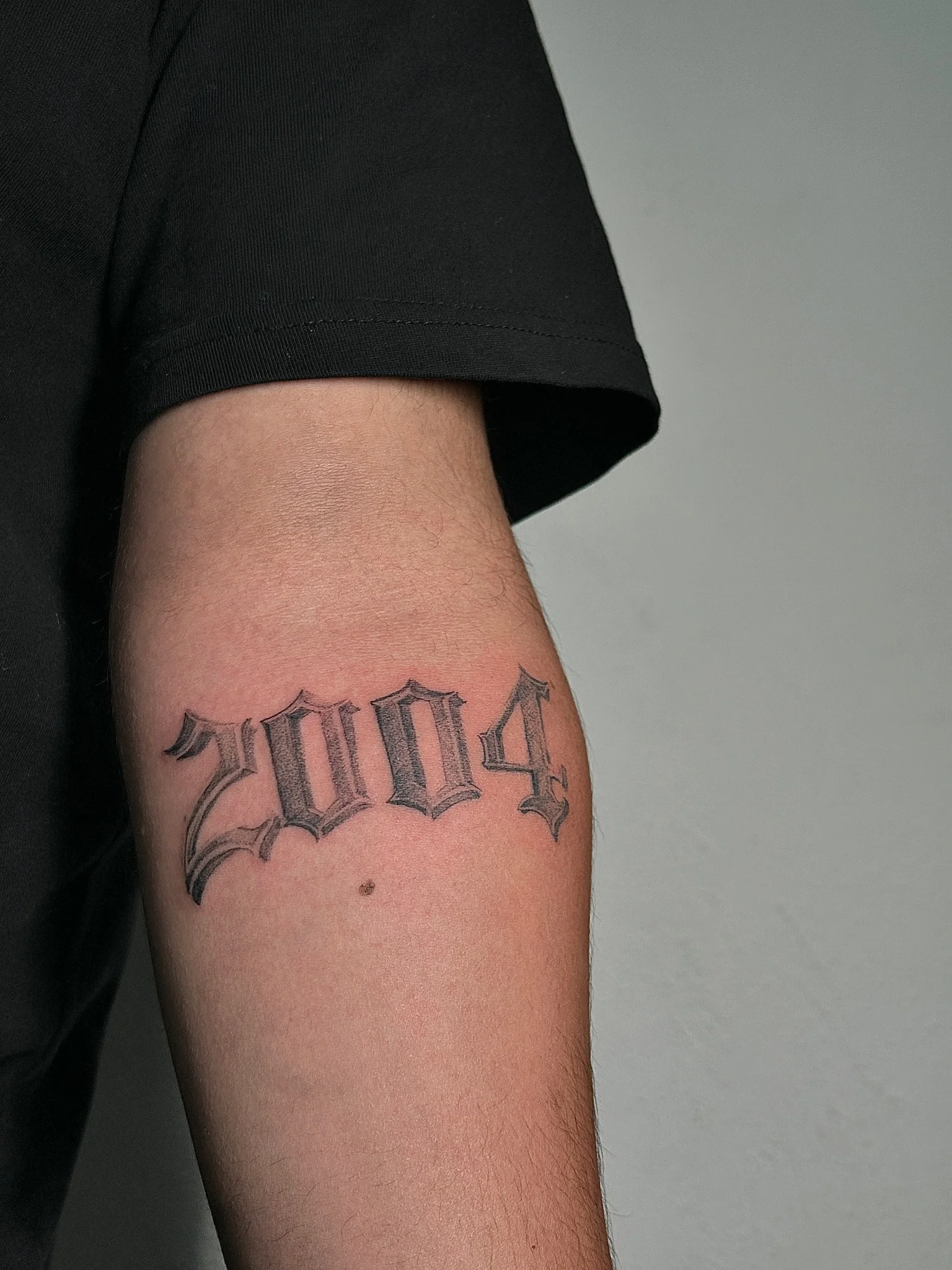 Calligraphy tattoo by El Chino Pérez