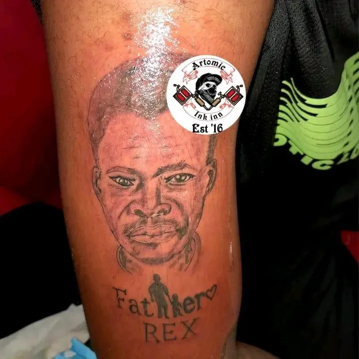 Black and grey realism portrait tattoo with memorial text on forearm